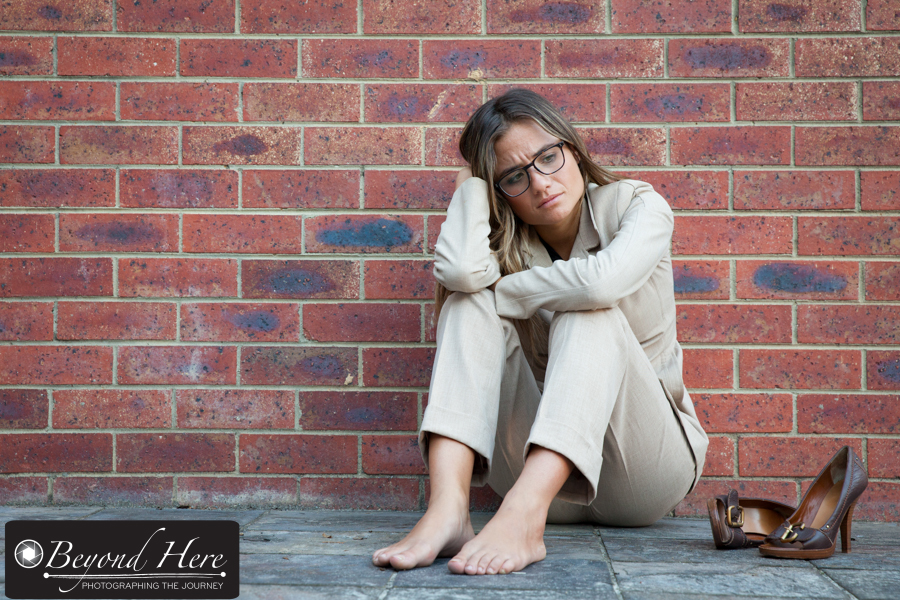 Businesswoman sitting on the ground